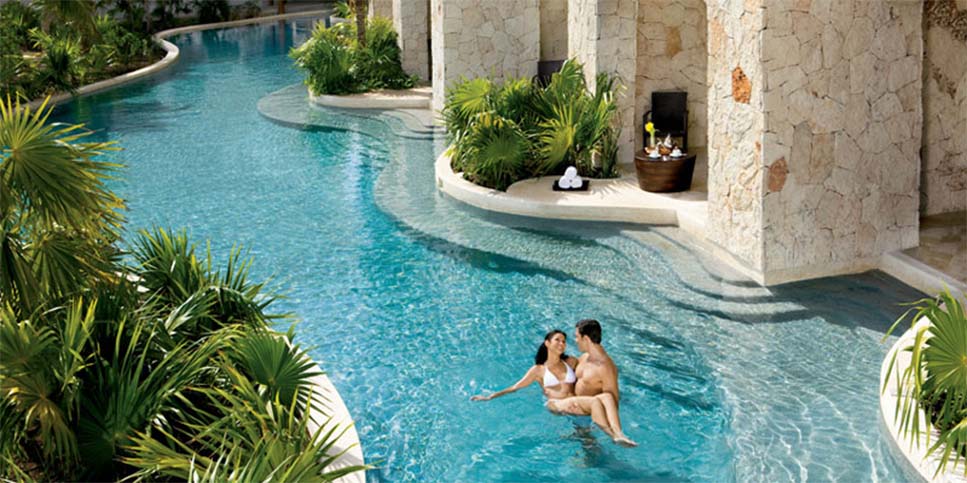 Couple in swimming pool at spa